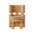 Tan Upholstered Accent Chair with Sculptural Wood Ball Legs and Curved Back